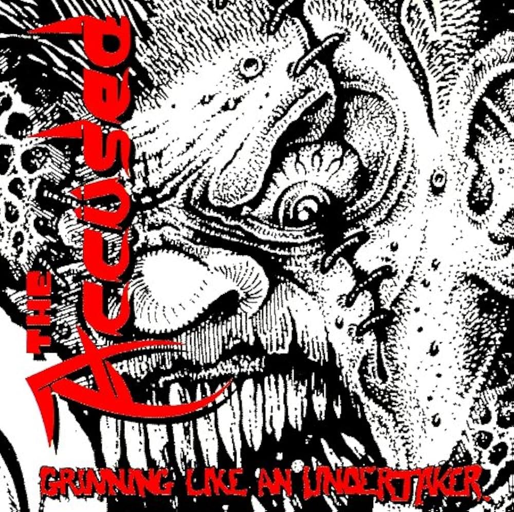 the accused - grinning like an undertaker